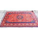 A RED GROUND RUG 133cm x 211cm Condition Report : good condition Condition reports are offered as