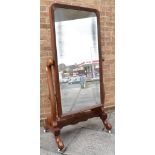 19TH CENTURY MAHOGANY CHEVAL MIRROR and raised on ceramic casters, the mirror measuring H 119cm x