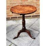 A SMALL OAK TILT TOP TABLE, raised on central column to three out swept feet H 65.5cm, diameter