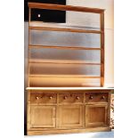 VICTORIAN PINE DRESSER, the upper section of four shelf configuration having an open back, above a