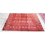 A RED GROUND BOKHARA RUG 130cm x 176cm Condition Report : a little faded but generally reasonable