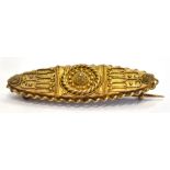 A VICTORIAN 15CT GOLD ETRUSCAN STYLE BROOCH 4.2cm long, width at widest point 1.2cm, marked 15ct,