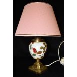 A ROYAL WORCESTER STYLE TABLE LAMP the ceramic body with gilded and painted decoration of