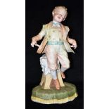 A LARGE LATE 19TH CENTURY COLOURED BISQUE FIGURE OF A BOY 40cm high overall Condition Report :