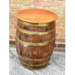 AN OAK AND BRASS BOUND BARREL, H 62cm x W 50cm