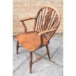 A CHILD'S WINDSOR ARMCHAIR with elm seat, H 82cm