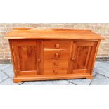 A FRUITWOOD DRESSER BASE, with four central drawers, each flanked by a cupboard with a fitted shelf,