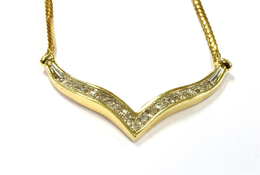A 14KT DIAMOND SET NECKLACE Marked, ITALY 14KT, the central V set with 15 small single cut