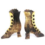 A PAIR OF HORN SPILL HOLDERS IN THE FORM OF A PAIR OF LADY'S ANKLE BOOTS 13cm high.