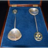 STEVEN MEDHURST SILVER SPOONS Limited edition, a pair of sterling silver spoons cased, bearing the
