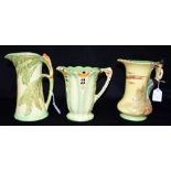 A BURLEIGH WARE 'PIED PIPER' JUG 21cm high, another with parrot to handle, and a leaf jug 18cm