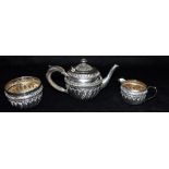 A CASED VICTORIAN SILVER 'TEA FOR ONE' SET Comprising of teapot, sugar bowl and milk jug, all