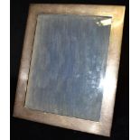 A VICTORIAN SILVER PHOTO FRAME Measuring 28cm by 23cm hallmarked for Birmingham date letter Z