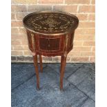 A FRENCH OVAL OCCASIONAL TABLE of three drawer configuration and having a brass galleried, inlaid