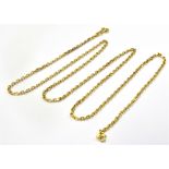 A CURB LINK YELLOW METAL CHAIN Tagged 750, 57.5 cm long and weighing 9.3 grams