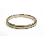 AN 18CT WHITE GOLD WEDDING BAND with rubbed hallmarks, possibly London 1966, maker E & G, size R,