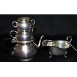 A SILVER GRAVY BOAT Hallmarked for Birmingham, date letter P, weight 110 grams together with a