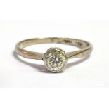 AN 18CT WHITE GOLD PLATINUM AND DIAMOND SOLITAIRE RING the bezel set round cut diamond measuring