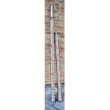 TWO SURVEYOR'S STAFFS each of extending form, the first by J. & W.E. Archbutt, London, 190cm long (