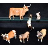 A GROUP OF BESWICK ANIMALS: A Jersey bull Dunsley Coy Boy model no 1422; Highland cow model 1740;