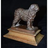 A BRONZE FIGURE OF A DOG stamped 'Elkington & Co.', on rectangular spreading wooden base, 15cm