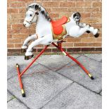 A MOBO 'PRAIRIE PRANCER' PRESSED STEEL RIDE-ON TOY HORSE on a tubular metal frame, overall 101cm