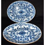 A PAIR OF OVAL DISHES each with underglaze blue foliate decoration within cafe-au-lait borders, 38cm