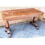 A WILLIAM IV ROSEWOOD LIBRARY TABLE of rectangular form, raised with column supports to lotus feet,