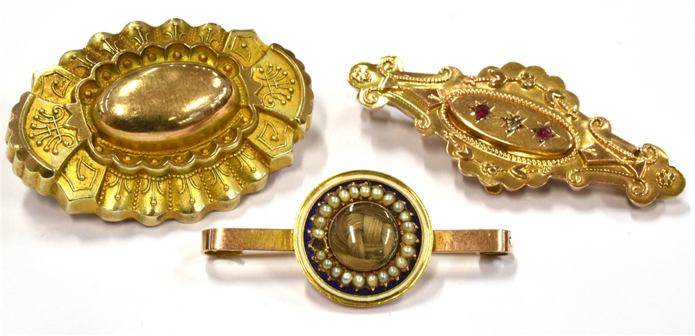 MEMORIAL BROOCHES three late 19th century to early 20th century brooches comprising a small 9ct gold