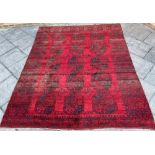 A LARGE RED GROUND BOKHARA TYPE CARPET 275cm x 345cm Condition Report : quite good condition, not
