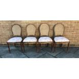 SET OF FOUR CANE BACK CHAIRS with pink floral upholstered seat, 92cm high