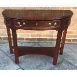 MAHOGANY DEMI LUNE TABLE having a central drawer, and open shelf unit below Condition Report :