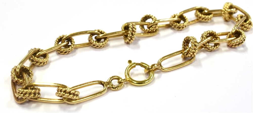 A YELLOW METAL BRACELET Of open work design, unmarked with testing indicating 14Kt, 17.5 cm long,