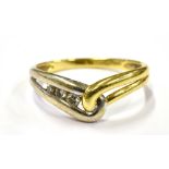 A DIAMOND SET WISHBONE RING On yellow metal with white metal detail, shank marked 18kt, ring size