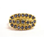 AN 18CT GOLD SAPPHIRE CLUSTER RING The boat shaped cluster head set with 21 small sapphires with the
