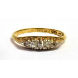 AN 18CT GOLD DIAMOND AND PLATINUM BOAT RING The five small graduated old cut diamonds set in a bed