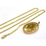 A 9CT GOLD LOCKET AND CHAIN the large 9ct gold oval locket, star set with white stone and engraved