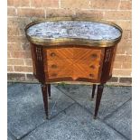 A FRENCH KIDNEY SHAPED TABLE of three drawer configuratio, having a marbled and brass galleried