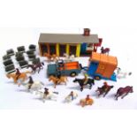 A BRITAINS RIDING SCHOOL & SHOW JUMPING COLLECTION comprising a stable block; Land Rover & horse