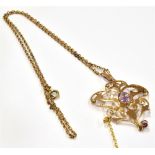 AN EDWARDIAN 9CT GOLD AMETHYST PENDANT NECKLACE the pendant of openwork design and set with two