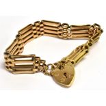A 9CT GOLD FOUR GATE BRACELET With heart padlock, weight approx. 16 grams