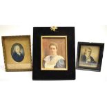 THREE PORTRAIT MINIATURES: an Edwardian watercolour on ivorine of a lady in ebonised easel back
