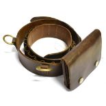 A LEATHER STALKING/BIG GAME HUNTING BELT for twelve bullets with two heavy brass hanging rings and a