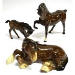 THREE BESWICK HORSES: a lying Shire Horse model 2459, a mare with head tucked, model 1549, and a