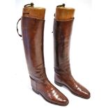 A PAIR OF TAN LEATHER 'CRAIG & DAVIES' RIDING BOOTS with trees, size 8