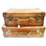 TWO VINTAGE LEATHER SUITCASES one stamped 'HARRODS LTD LONDON SW', 72cm wide 44cm deep 22cm high;