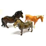 THREE BESWICK HORSES: a Shetland pony, brown gloss model 1033, another Shetland pony model 1648, and