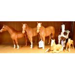 A GROUP OF BESWICK HORSES: two Palomino horses 17cm high, another Palomino 16cm high, a Palomino