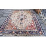 A PERSIAN TABRIZ CARPET the main field with central medallion and foliate spandrels, within a