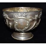 AN EDWARDIAN SILVER BOWL The bowl standing on a pedestal base has embossed ribbed and floral